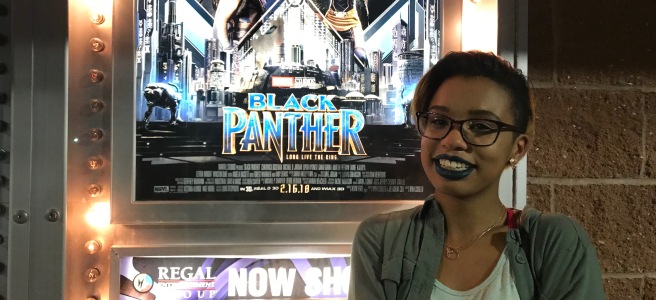 me crying in front of the Black Panther poster